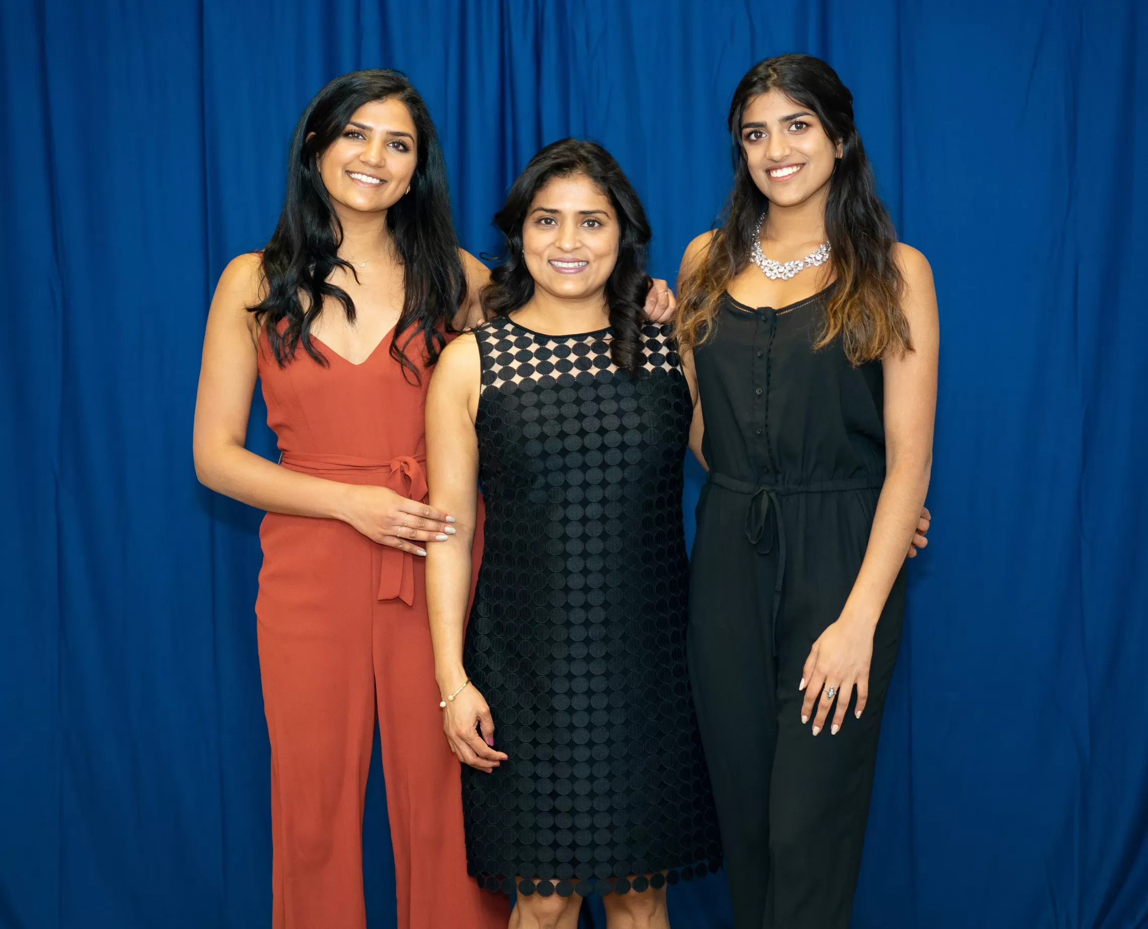 group of women standing smiling