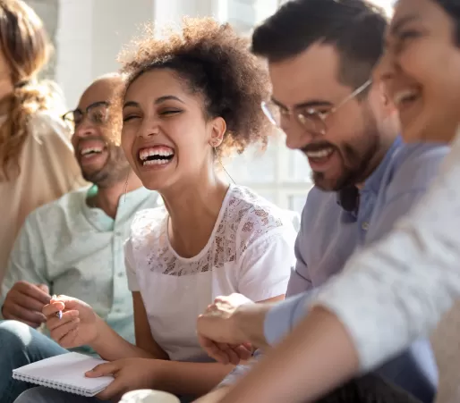 Adult woman laughing with group
