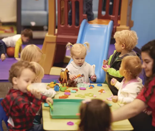 Toddlers playing with playdoh