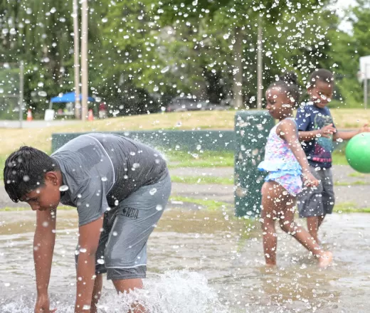 Children playing in water for camp