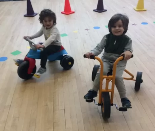 kids riding bikes inside