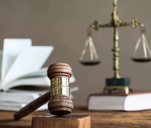 gavel on table with book
